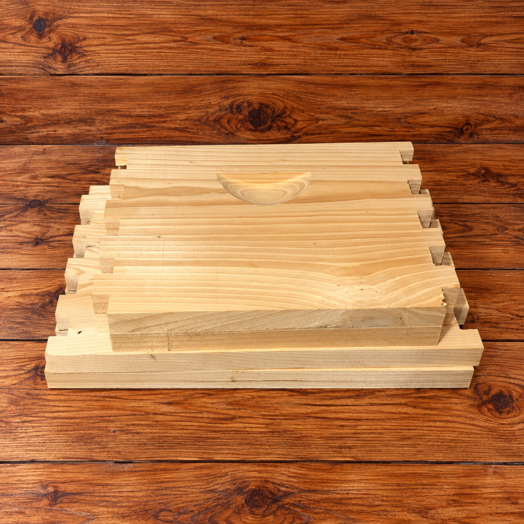 Unssembled 10-frame cypress deep beehive super without frames, featuring natural cypress wood, finger-jointed corners, and recessed handholds.