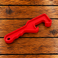 Plastic bucket opener for removing lids from honey buckets