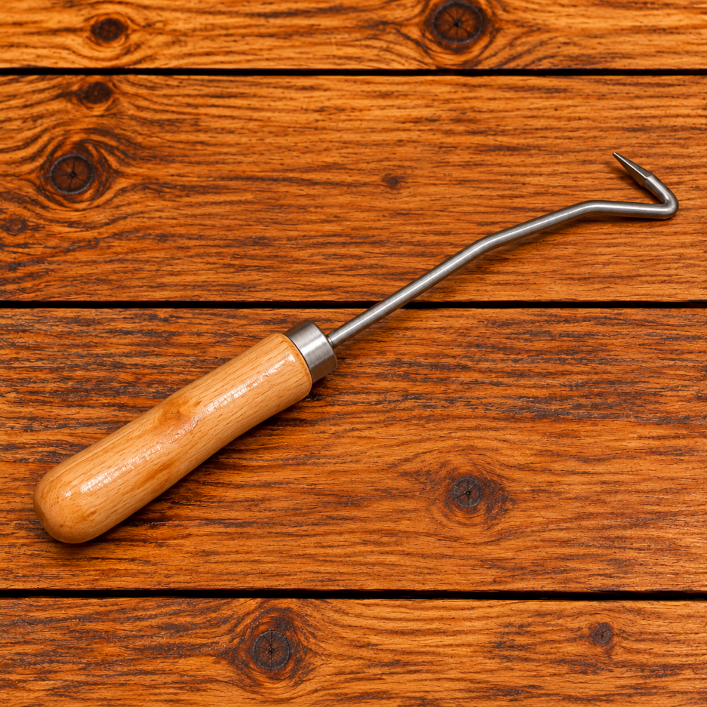 Beekeeping frame cleaning tool with wooden handle, angled steel shaft, and hooked tip for removing wax, propolis, and debris from wooden hive frame grooves.
 Copy