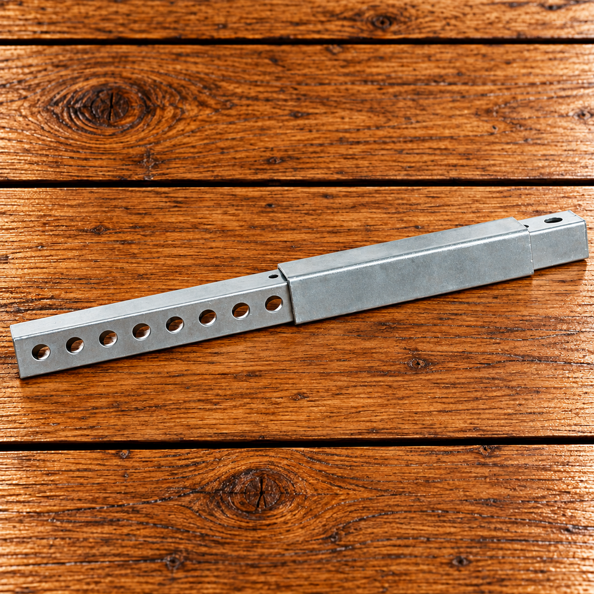 Adjustable metal mouse guard for honey bee hive entrances